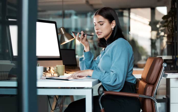 Phone call, woman and computer in office at night with screen, space and mockup, speaker phone and